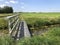 Bridge over a canal at farmland