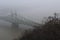 Bridge over Danube river in the fog city road panoramic photo Budapest