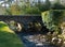 The bridge over the famous Glendalough Monastic site with its round tower and cemetery in the Wicklow mountains in County Wicklow,