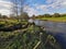 Bridge over the hot stream as nature reclaims