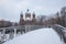 Bridge over isar river with view to st luke church, munich in wi