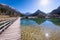 Bridge over lake Jasna with mountains Razor Prisojnik in Slovenia