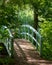 Bridge over the lake at the Millennium Garden at Pensthorpe Natural Park, Norfolk UK, designed by Piet Oudolf.