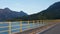 Bridge over lake among mountains.