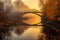 bridge over a misty river during golden hour