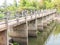 The bridge over the overflowing weir in the countryside stands