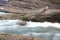 Bridge over rapid runoff water from glacier