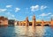 A bridge over a river with a building in the background. Oberbaumbruecke in Berlin on a bright sunny day.