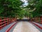 Bridge over the river henares with red pads and stone floor for entrance to a farm with an iron gate closing it