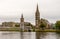 Bridge over river Ness leading to the famous tall Gothic style Free Church of Scotland, Inverness