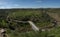 Bridge over River Oeiras and winding road at Mertola