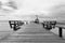 Bridge over the sea during ebb tide in black and white