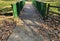 A bridge over a stream with steep banks.