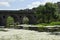 Bridge over the Tozo river full of Ranunculus aquatilis or aquatic buttercup is a species belonging to the Ranunculaceae family