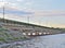 Bridge over a wide river before sunset