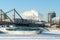 Bridge, pleasure boat, frozen river, power plant pipes, spewing