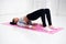 Bridge pose sporty woman doing warming up exercise for spine, backbend, arching stretching her back working out at home