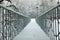 Bridge with railings in a snow-covered winter park