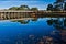 Bridge Reflecting In Water of Calm Lake at Hill Country Ranch