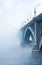 Bridge on river in cold steam