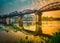 The bridge on the river Kwai at sunrise. Railway in Kanchanaburi, Thailand