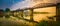 The bridge on the river Kwai at sunrise. Railway in Kanchanaburi, Thailand. Panorama