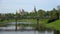 The bridge on the river Tvertsa and old Boris and Gleb monastery. Torzhok, Russia