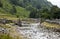 Bridge with slow flowing river in countryside