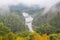 Bridge and Tadami river with train crossing the bridge