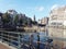 Bridge and tour boats in central Amsterdam on a sunny day