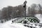 A bridge under the snow. Russian winter. Color photo.