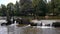 Bridge, waterfall and kayak in Pont d Ouilly, Normandy France