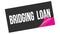 BRIDGING  LOAN text on black pink sticker stamp