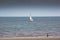 Bridlington North Beach with a yacht and lone person