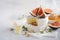Brie or camembert cheese with figs, thyme, honey and nuts.
