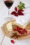 Brie, soft French cow\'s milk cheese, autumn leaves and a winegl