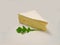 Brie type of cheese. Fresh Brie cheese and with green leavesrucola