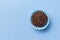 Brigadeiro is a chocolate truffle from Brazil. Cocoa and sprinkles of chocolate. Children birthday party sweet. Top view of candy