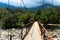 Brigde across mountain river  flowing along rice terraces