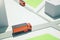 Bright 3D Rendering route with orange lorry vehicles.