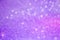 Bright and abstract blurred purple bokeh background with shimmer