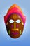 Bright african wooden mask on blue background