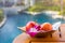 Bright apple with orchid in plate on the table