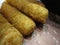 Bright attractive delicious deep fried crispy mozzarella cheese sticks close up