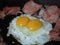 Bright attractive delicious fresh double yolk sunny side up with luncheon meat close up