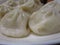 Bright attractive delicious steamed Chinese dim sum home-made pork buns 2019