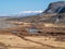 Bright autumn mountain steppe landscape. Awesome alpine view from pass to mountain valley in sunlight and great mountain