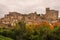 Bright autumn view with yellow and orange trees to medieval town of Nazzano in Lazio, Italy