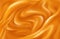 Bright background of swirling waves of orange juice