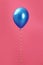 Bright balloon with ribbon